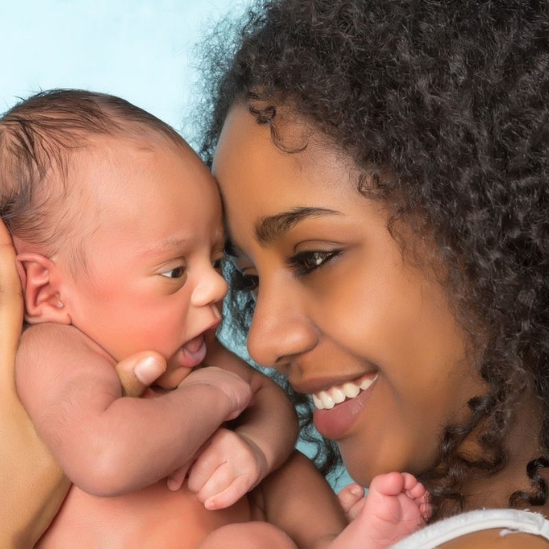 Woman embracing a baby