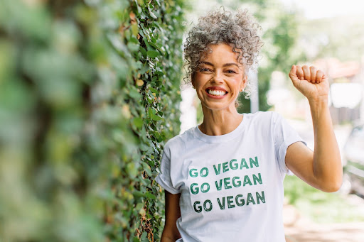 Women wearing a shirt saying "Go Vegan."